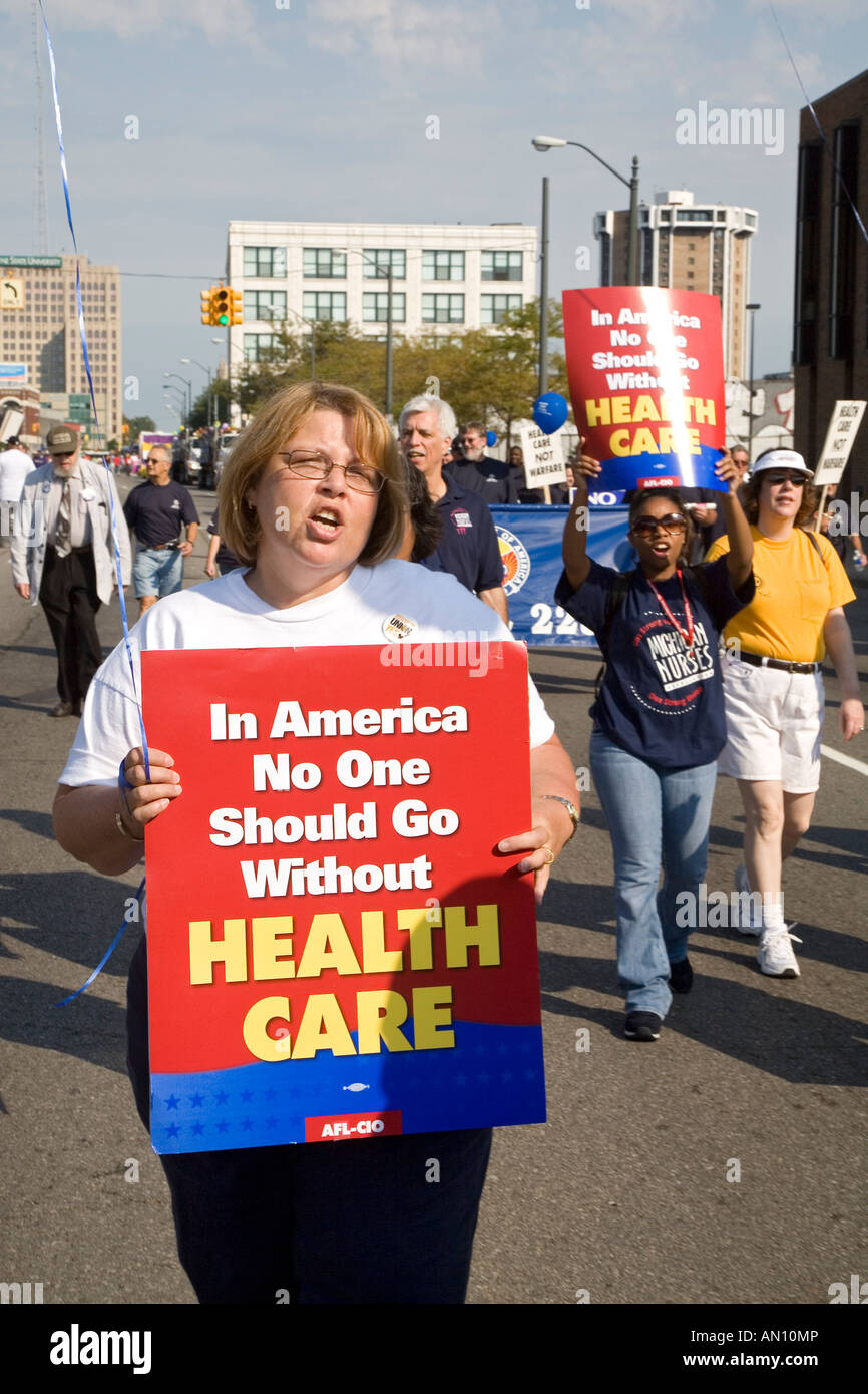 Detroit Michigan Participants in the Labor Day parade carry signs ...