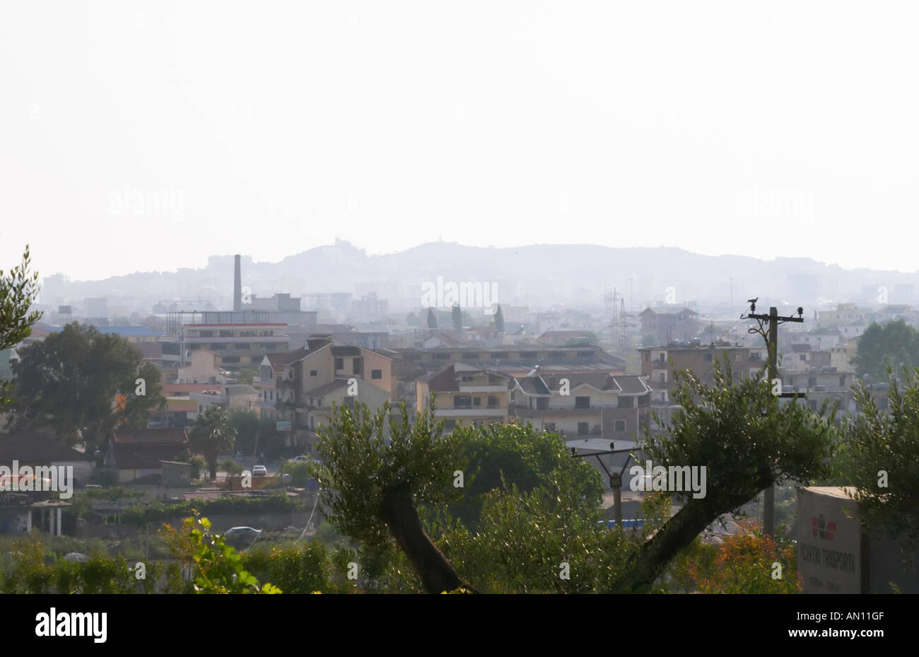 View over rooftops in Durres in hot hazy summer weather. Durres on the