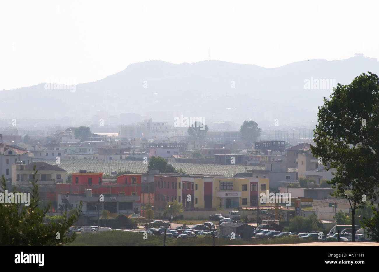 View over rooftops in Durres in hot hazy summer weather. Durres on the