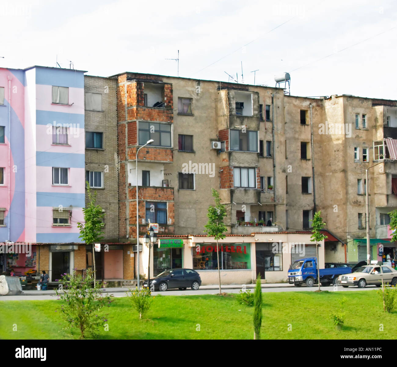 Street scene with typical colourful houses, in rather bad shape. Tirana