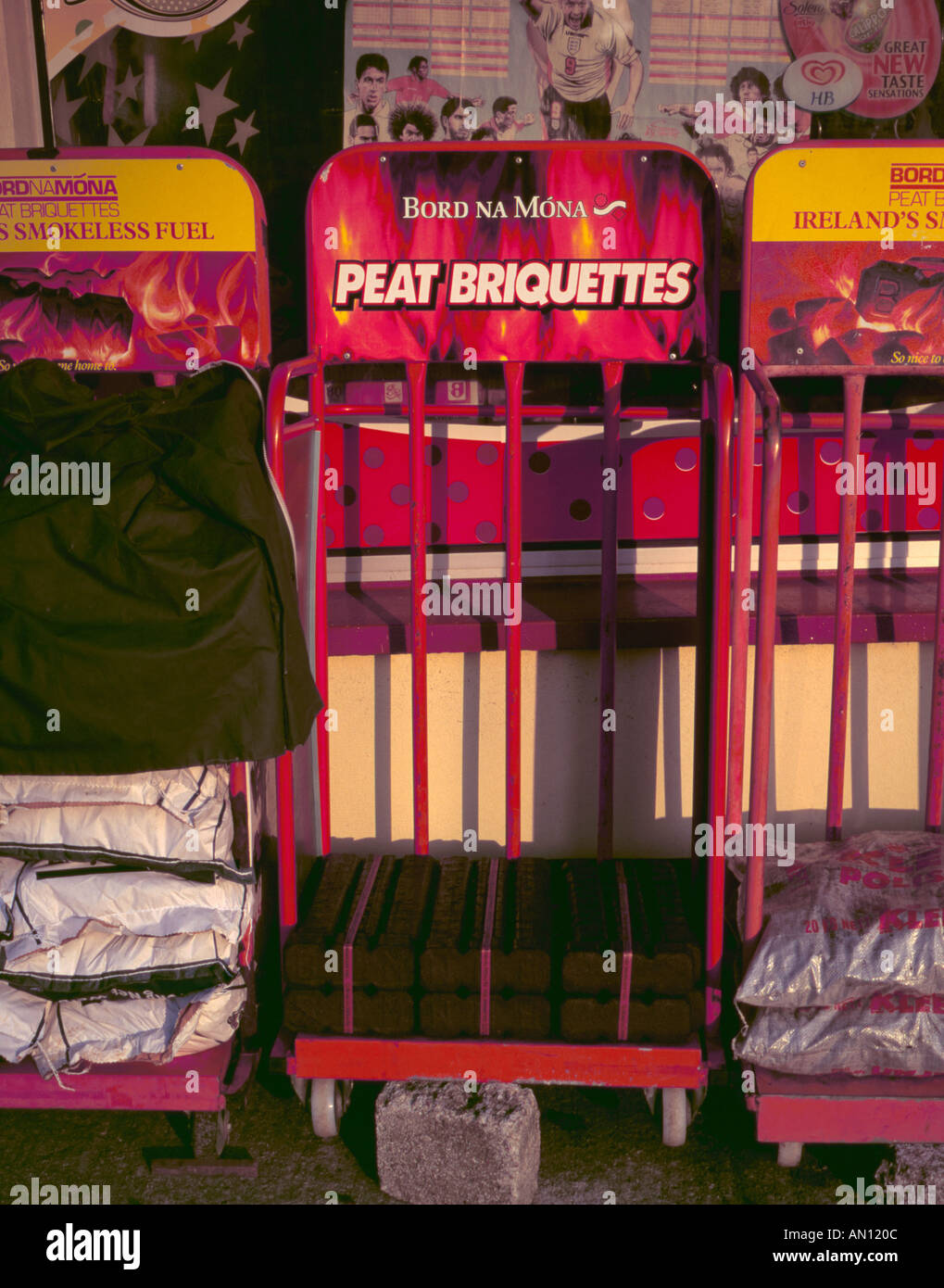 Peat briquettes on sale outside a rural store, County Limerick, Eire (Ireland). Stock Photo