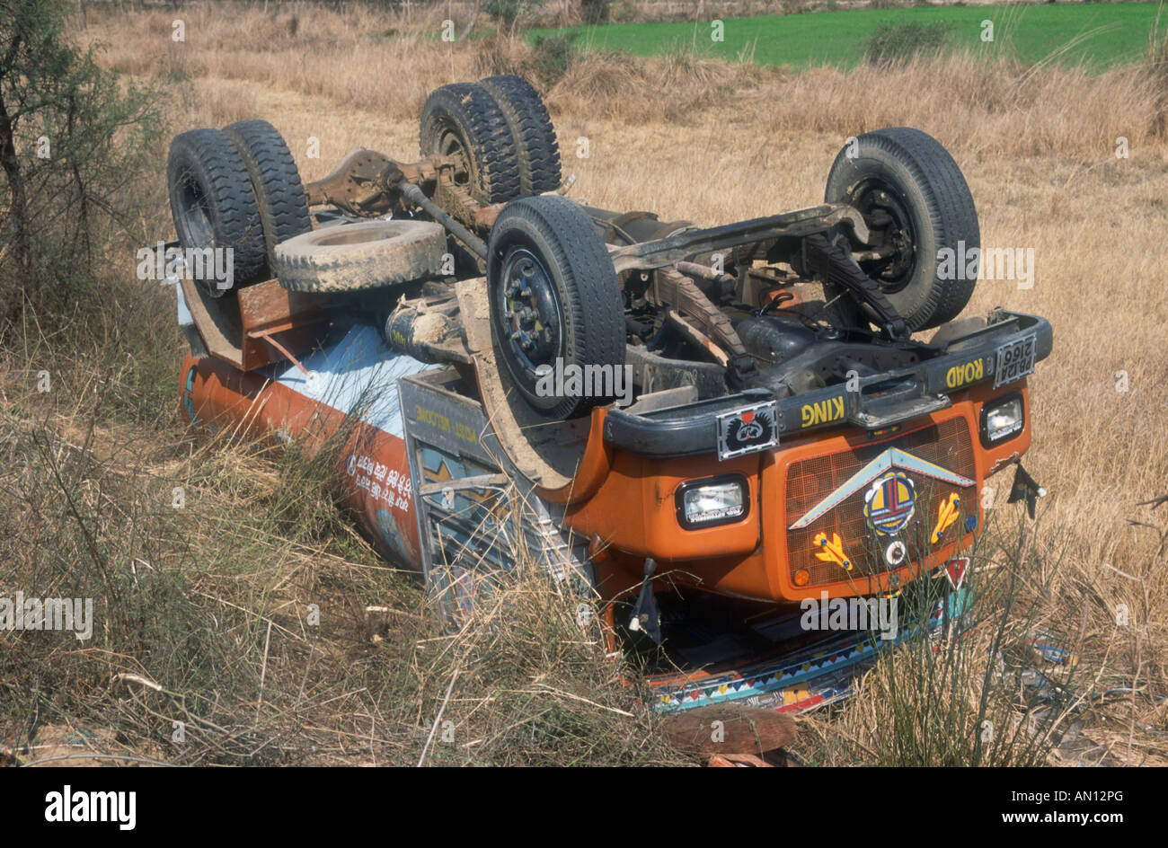Road accident in India, with overturned lorry by road side. Stock Photo