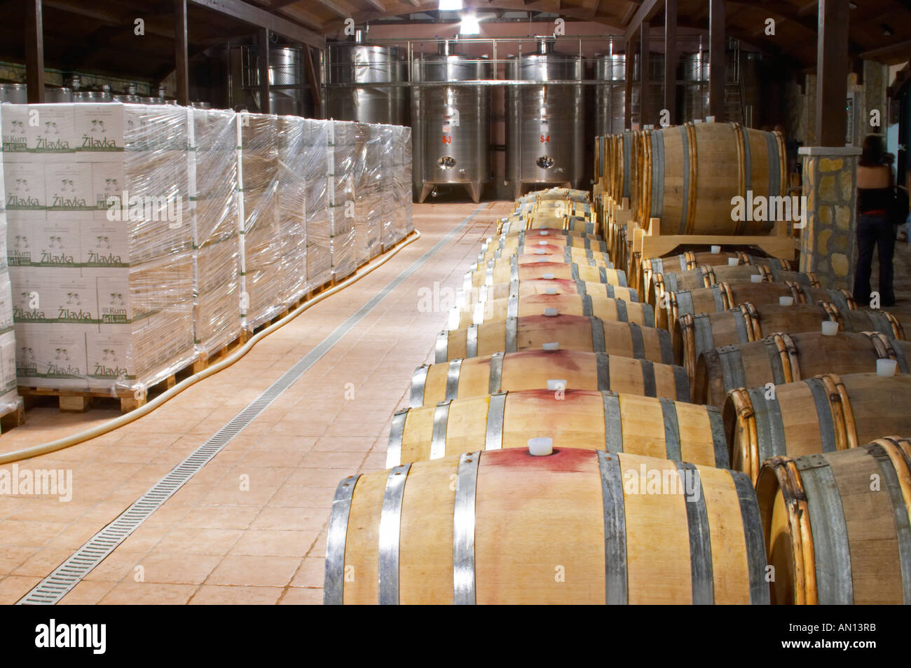 Oak barrels and stainless steel fermentation and storage tanks in the