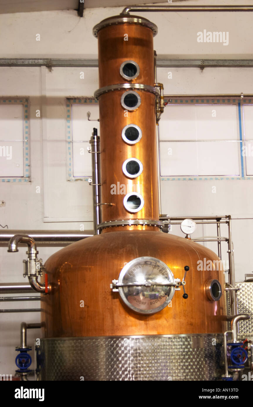 A distillation machine still in stainless steel and copper with narrow