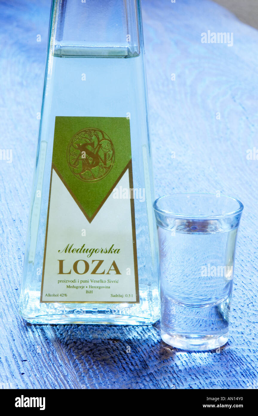 Triangular pyramid shaped Bottle of Loza rakija grappa type grape