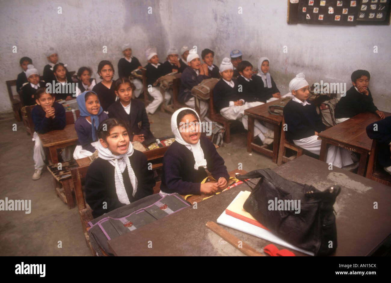 School pupils sitting at desks in secondary modern school, Punjabi University, Patiala, Punjab, India. Stock Photo