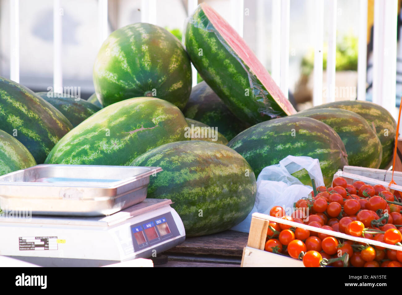 Water melons and tomatoes. In the fruit and vegetable market in the