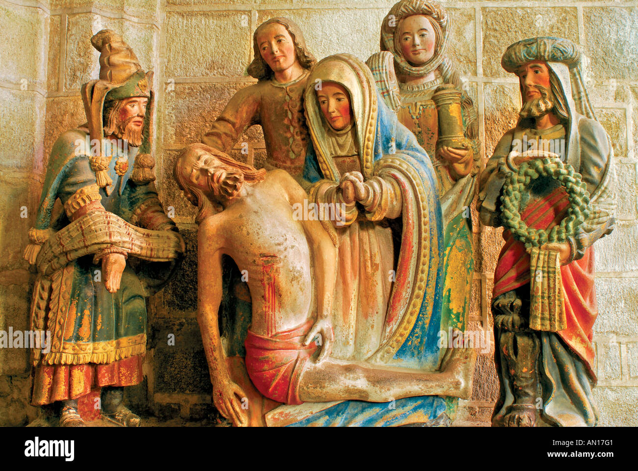 Historic figure group showing dead Jesus being prepared for funeral, chapel Pénity, Locronan, Brittany, France Stock Photo