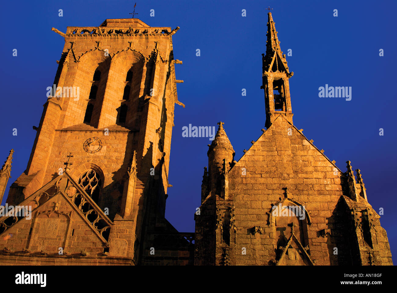 Church Saint Ronan and chapel Pénity by night, Locronan, Brittany, France Stock Photo