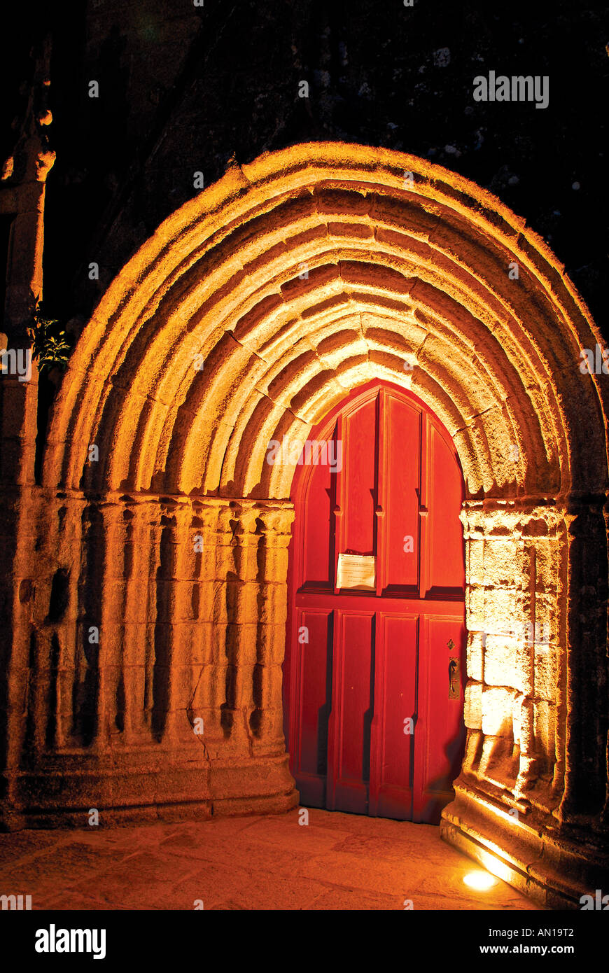 Entrance portal of church Notre Dame des Tronoën at night, Tronoën, Brittany, France Stock Photo