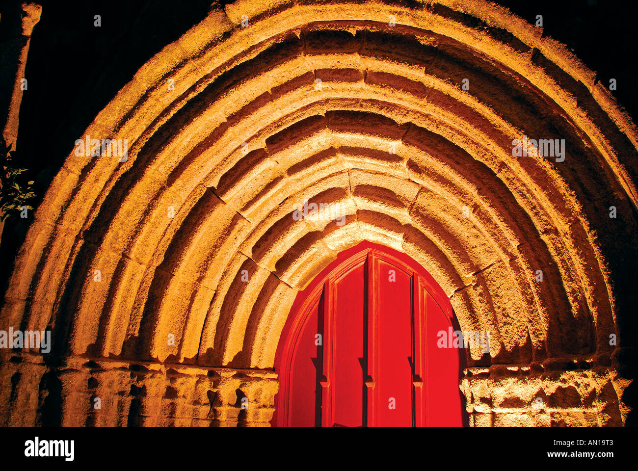 Entrance portal of church Notre Dame des Tronoën  by night, Tronoën, Brittany, France Stock Photo
