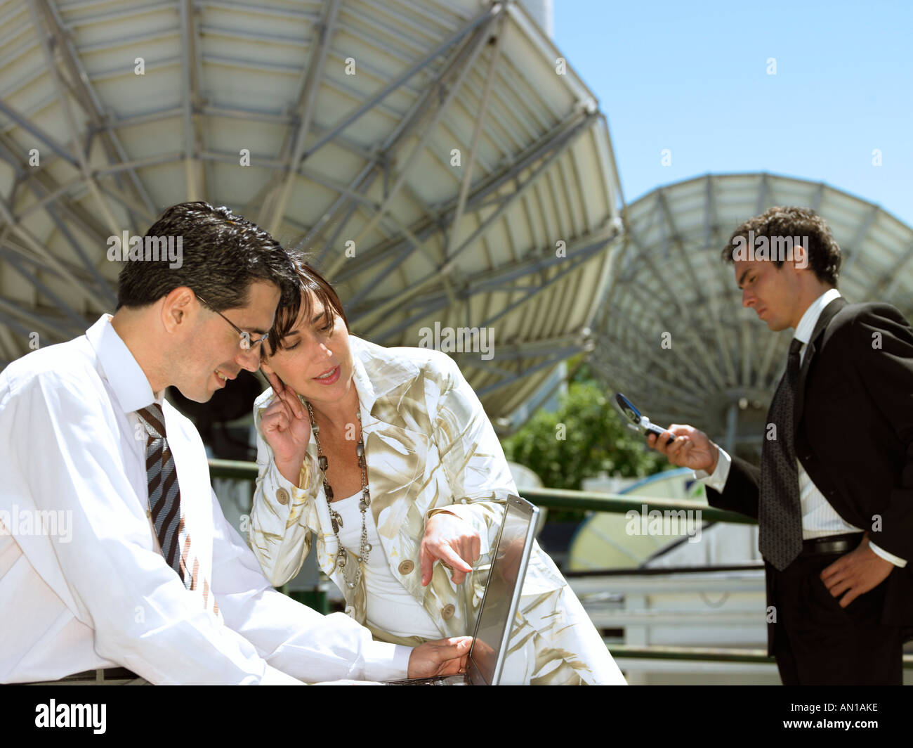Three professionals on a rooftop Stock Photo