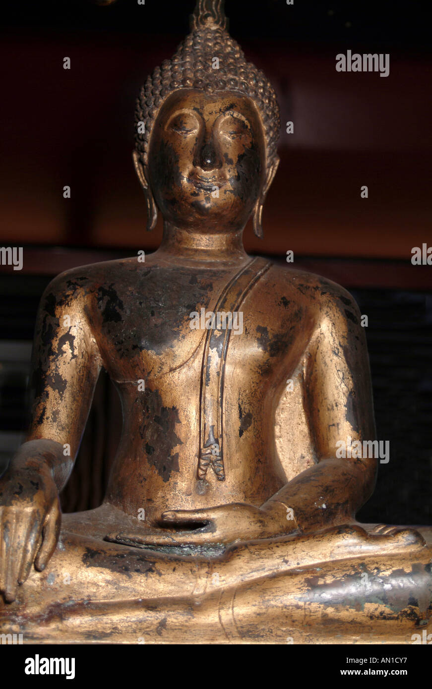 Golden sitting Buddha sculpture asia symbol Stock Photo