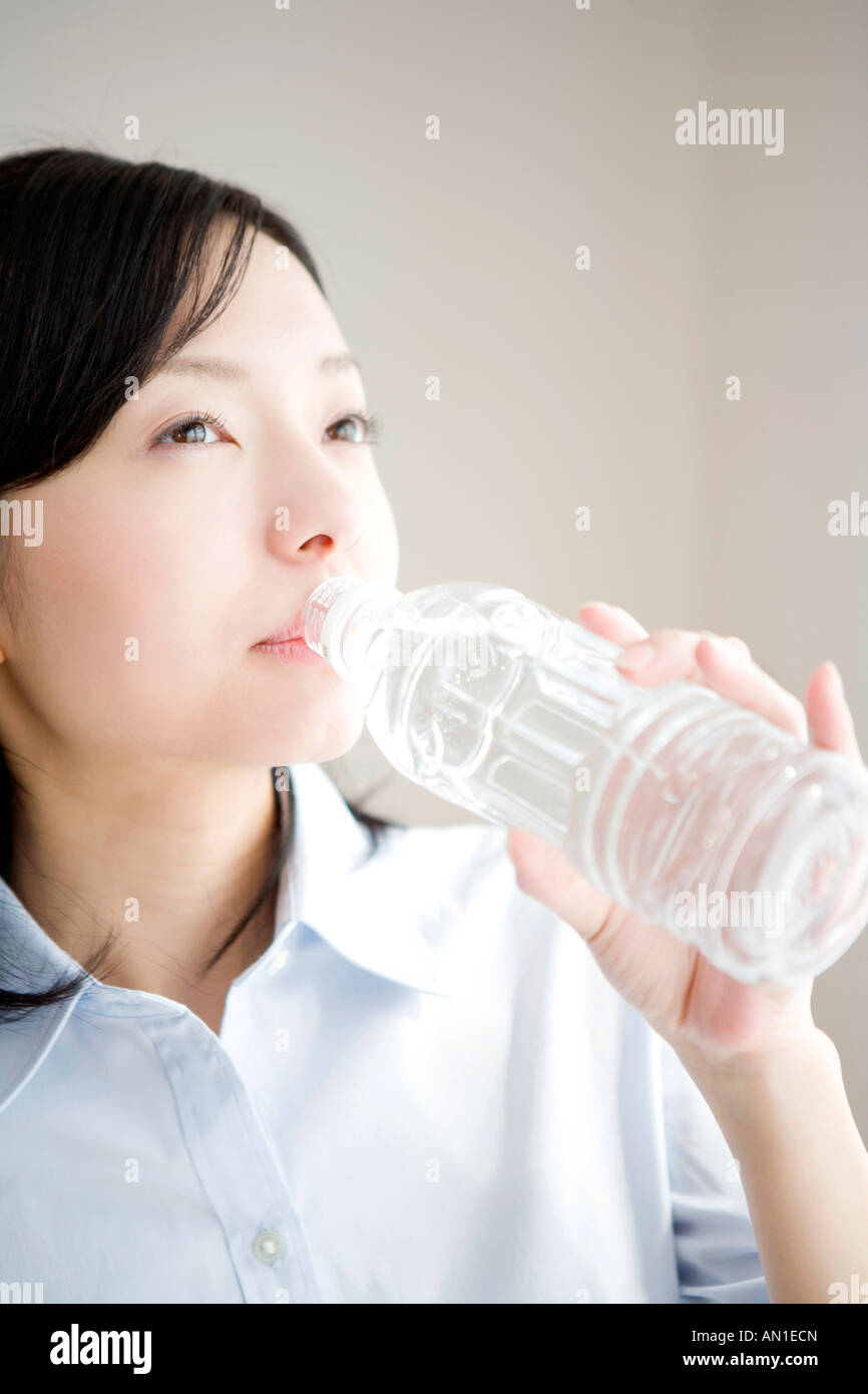 Japanese woman drinking a water Stock Photo Alamy