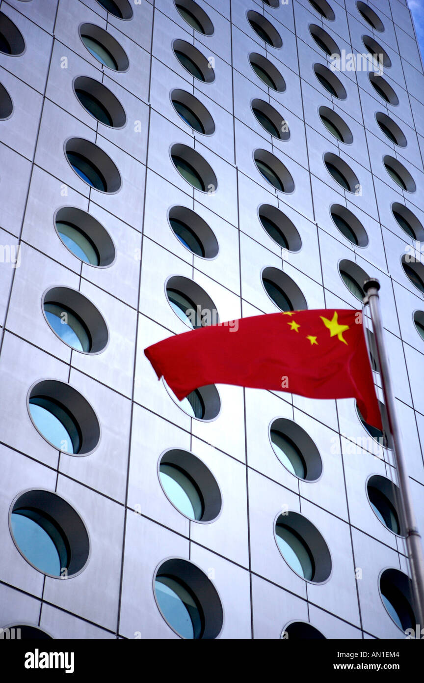 Jardine House, Hong Kong, with the Chinese flag fluttering outside