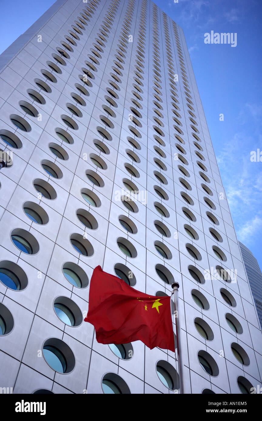 Jardine House, Hong Kong, with the Chinese flag fluttering outside