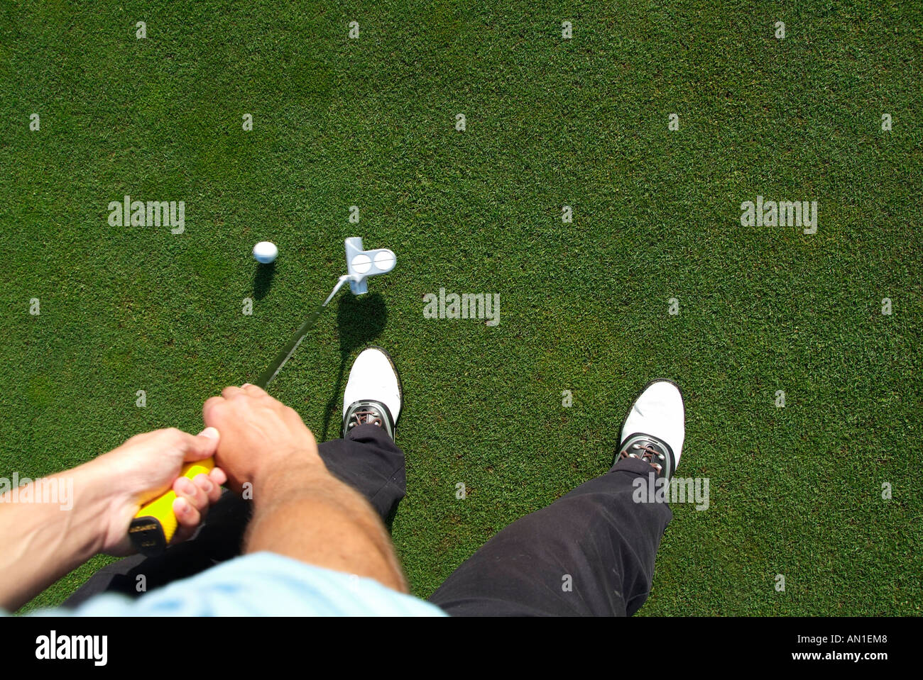 Golf Golfing Golfsport, close-up of a golf player putting his ball on greenfee, view from top Stock Photo