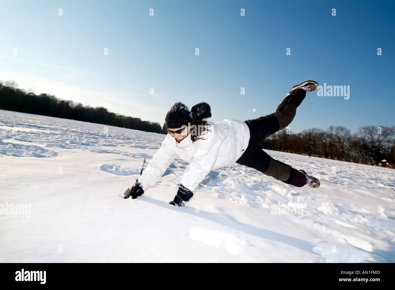 young sportive woman enjoying snow in hamburg - Germany, fun, snowy, Lifestyle Stock Photo