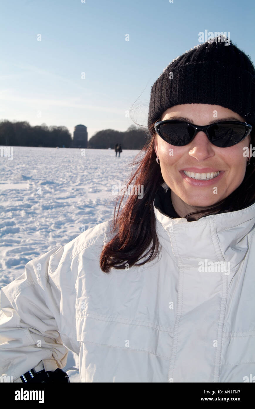 young woman enjoying snow in hamburg - Germany, fun, snowy, Lifestyle Stock Photo