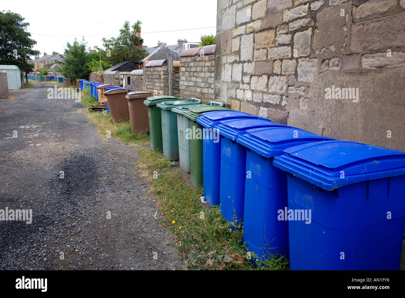 Green blue and brown plastic wheelie bins used for recycling household