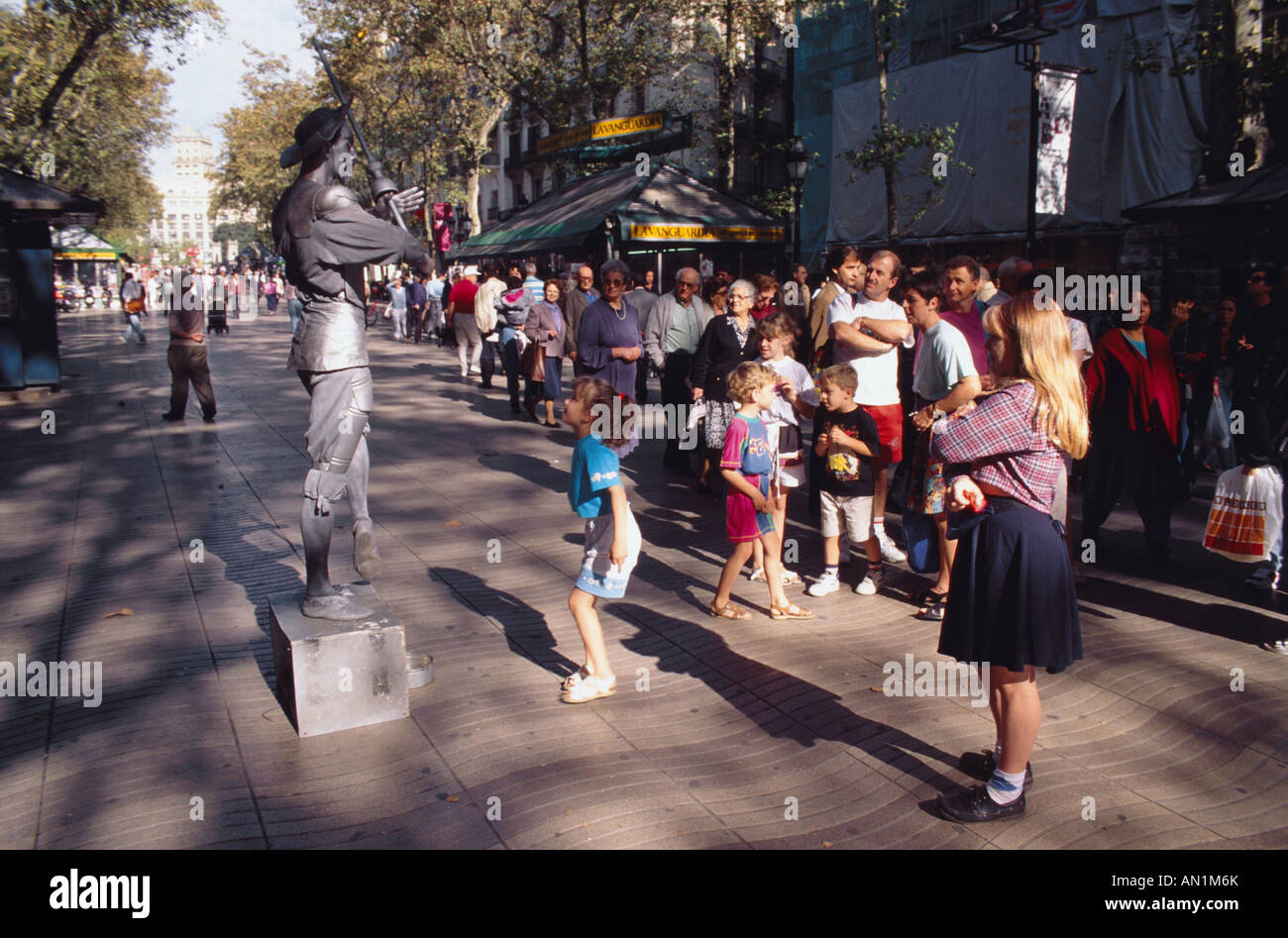 Crowd of people walking along street in Las Ramblas, Barcelona. Stock Photo