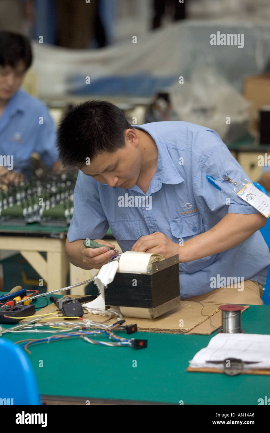 Chinese Workers Manufacturing Transformers In A Factory Shanghai Stock