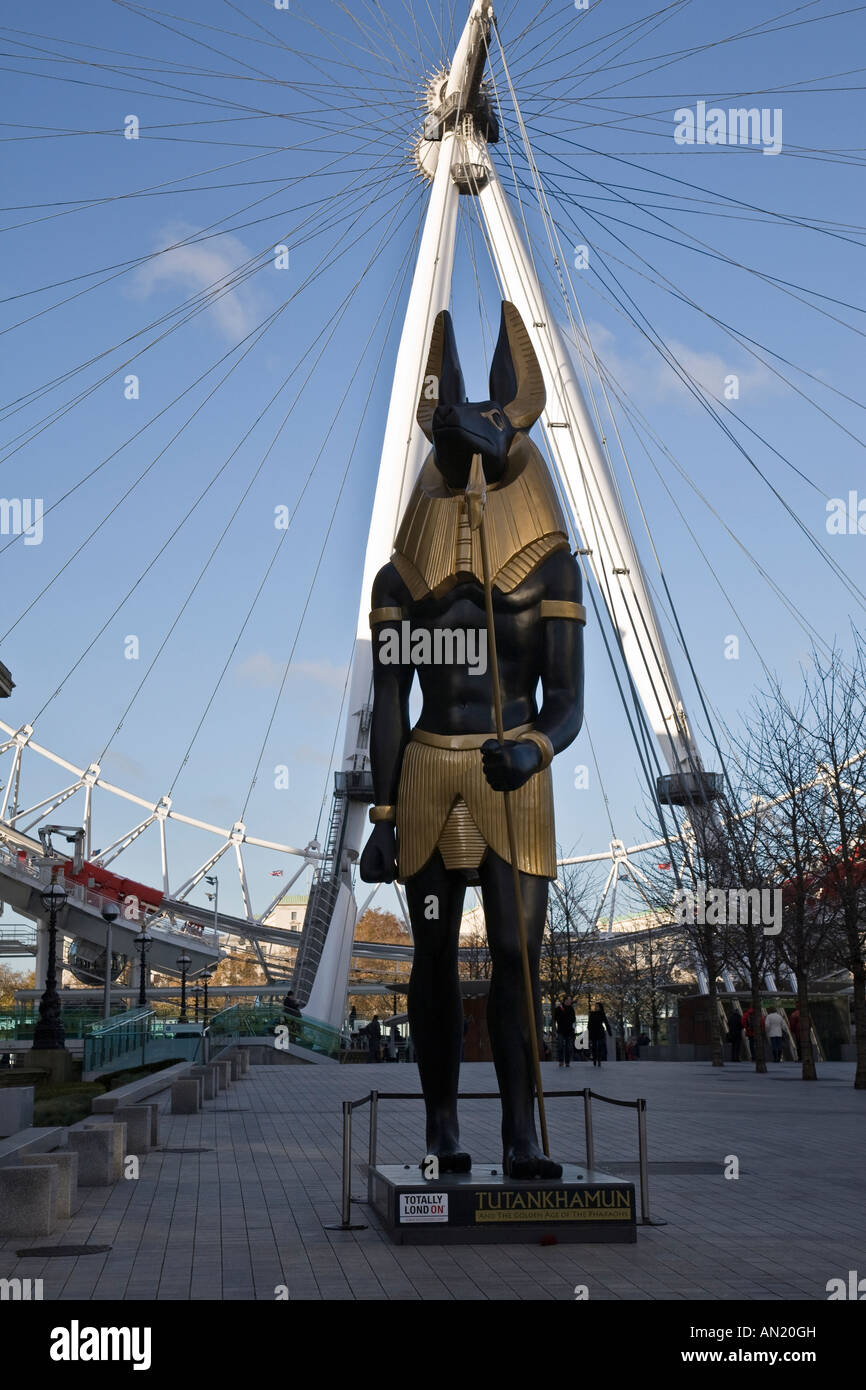 A sculpture of Anubis advertising the Tutankhamun exhibition with the London Eye in the background, London, England. Stock Photo