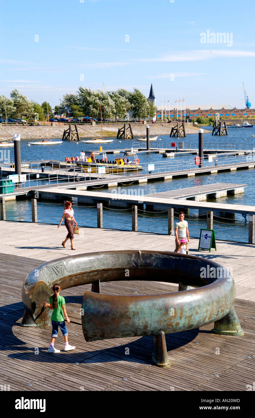 Metal ring sculpture artwork on public boardwalk at Cardiff Bay South