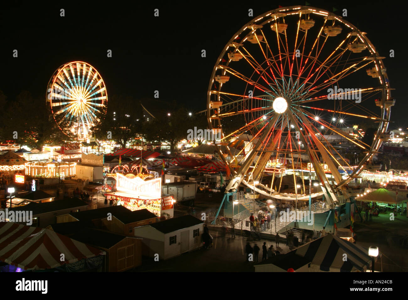 Raleigh North Carolina,North Carolina State Fair,carnival rides at night,darkness,dark,night nightlife evening after dark,social,entertainment,perform Stock Photo