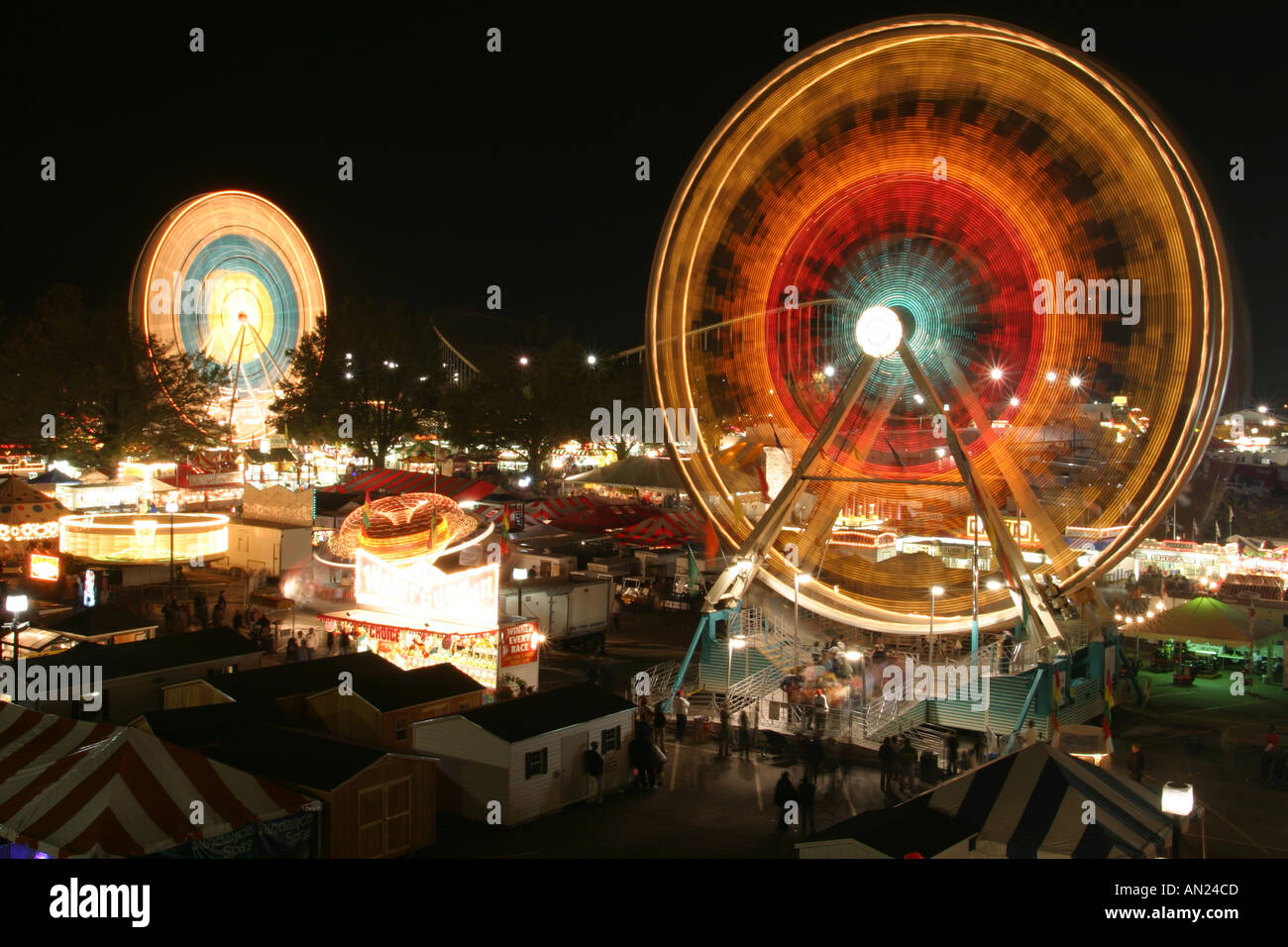 Raleigh North Carolina,North Carolina State Fair,carnival rides at night,darkness,dark,night evening,social,entertainment,performance,show,NC 102603 0 Stock Photo