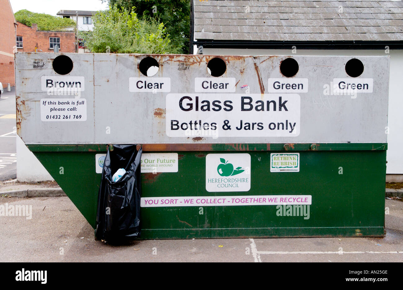 Glass Bank skip for recycling glass bottles and jars of many colours in