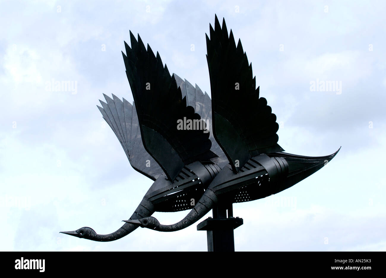Flying Swans sculpture by Polish sculptor Walenty Pytel on river bank ...
