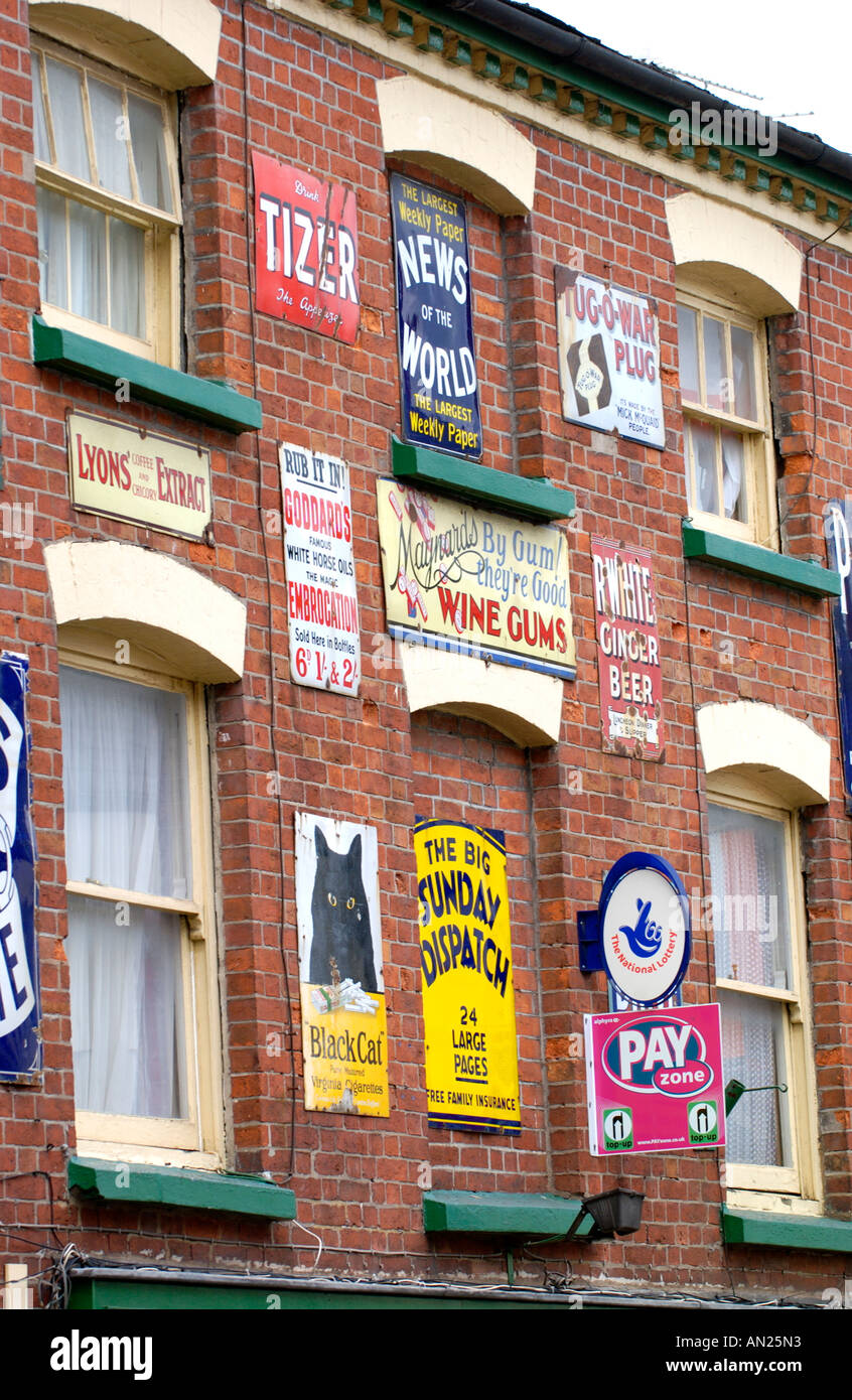 Gwalia independent store displaying old enamel advertising signs in rural market town of Ross on Wye Herefordshire England UK Stock Photo