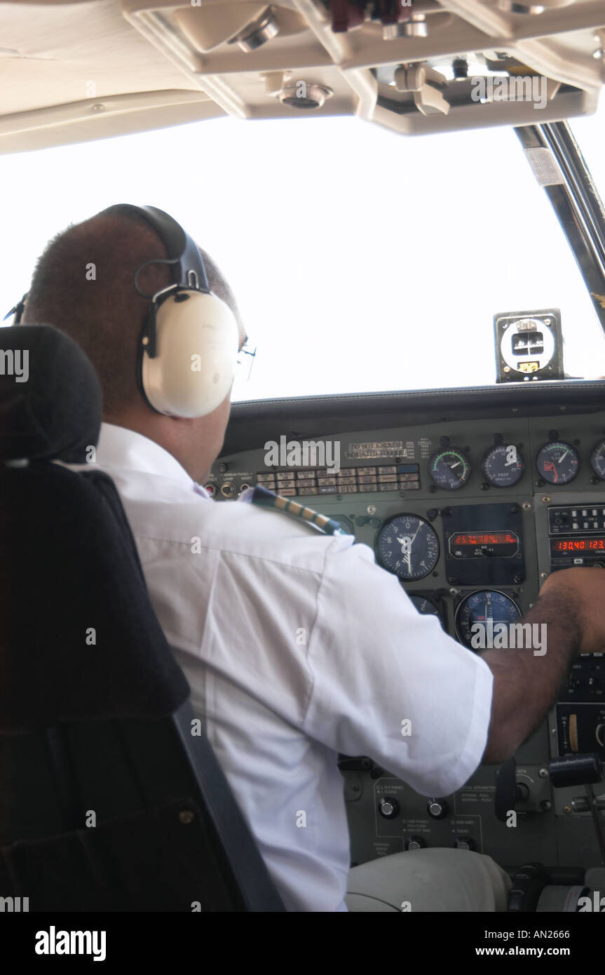 Light aircraft pilot at controls flying Stock Photo Alamy