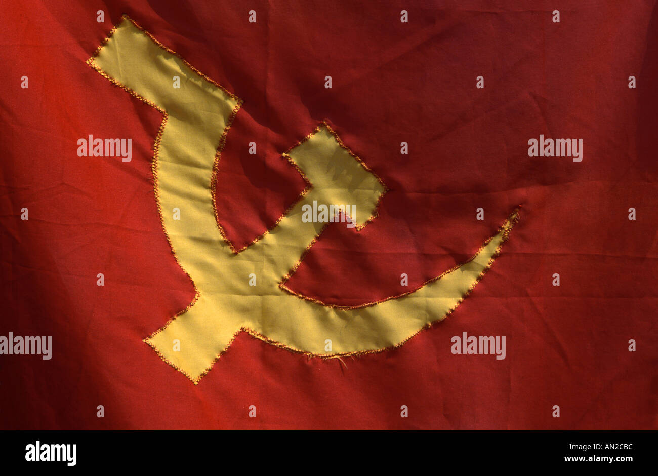 Lao Communist Party flag bold socialist iconography hammer and sickle Stock Photo