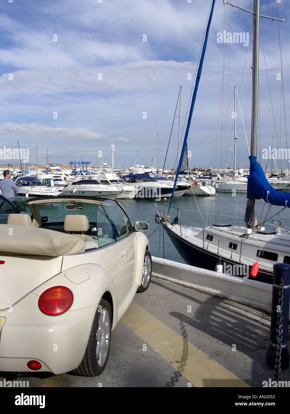 Volkswagen Beetle Convertible car and boats Puerto Banus Costa del Sol Spain Stock Photo