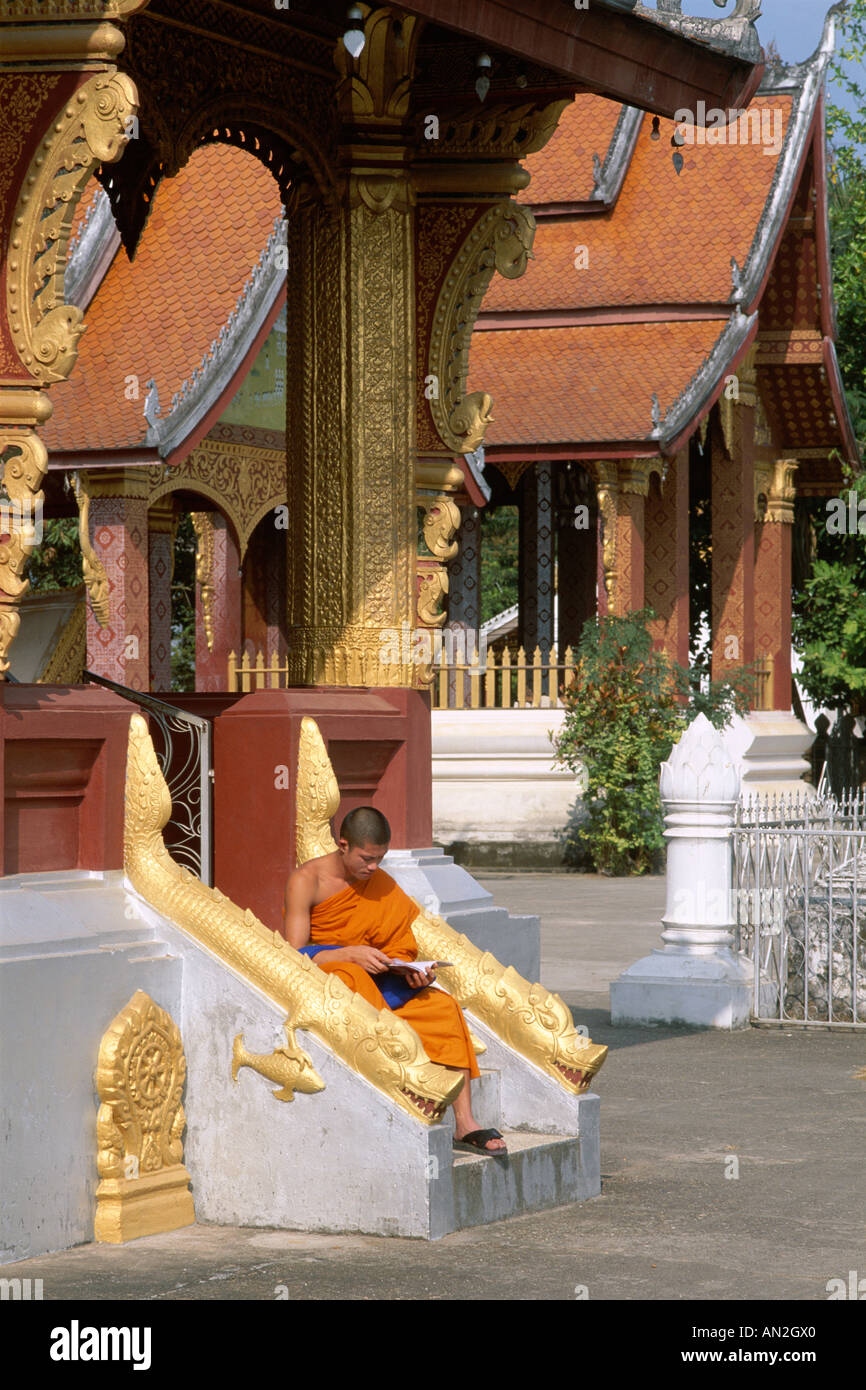 Wat Saen / Novice Monk Studying, Luang Prabang, Laos Stock Photo