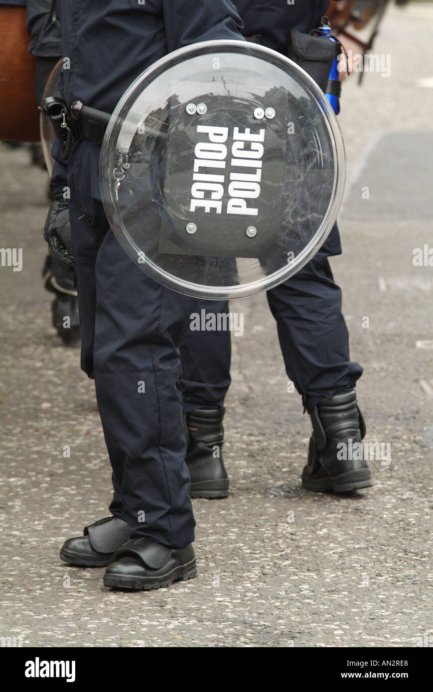 Riot policeman holding a shield Stock Photo