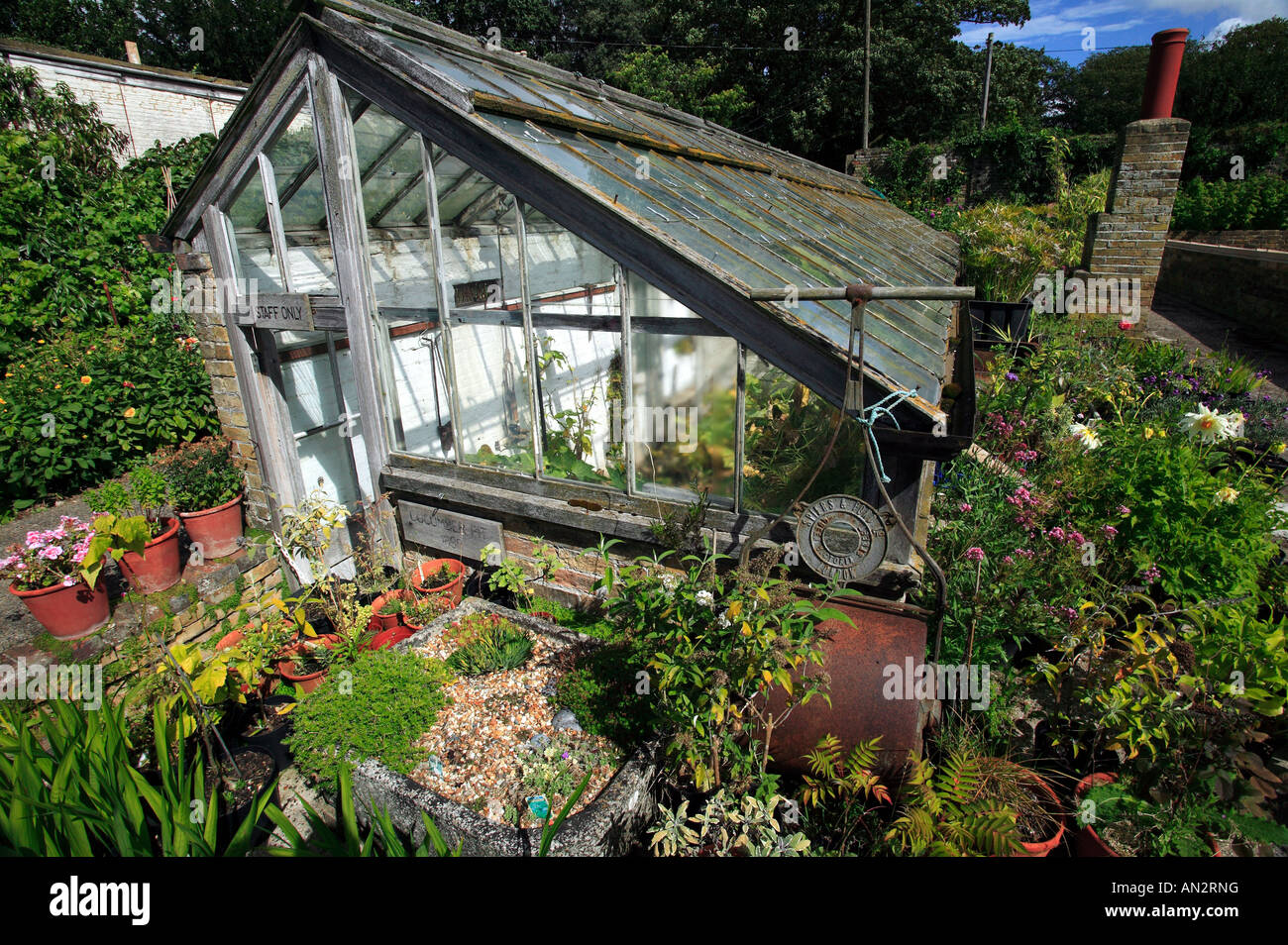 An old Victorian glasshouse in the walled kitchen garden at Quex House, Birchington, Kent Stock Photo