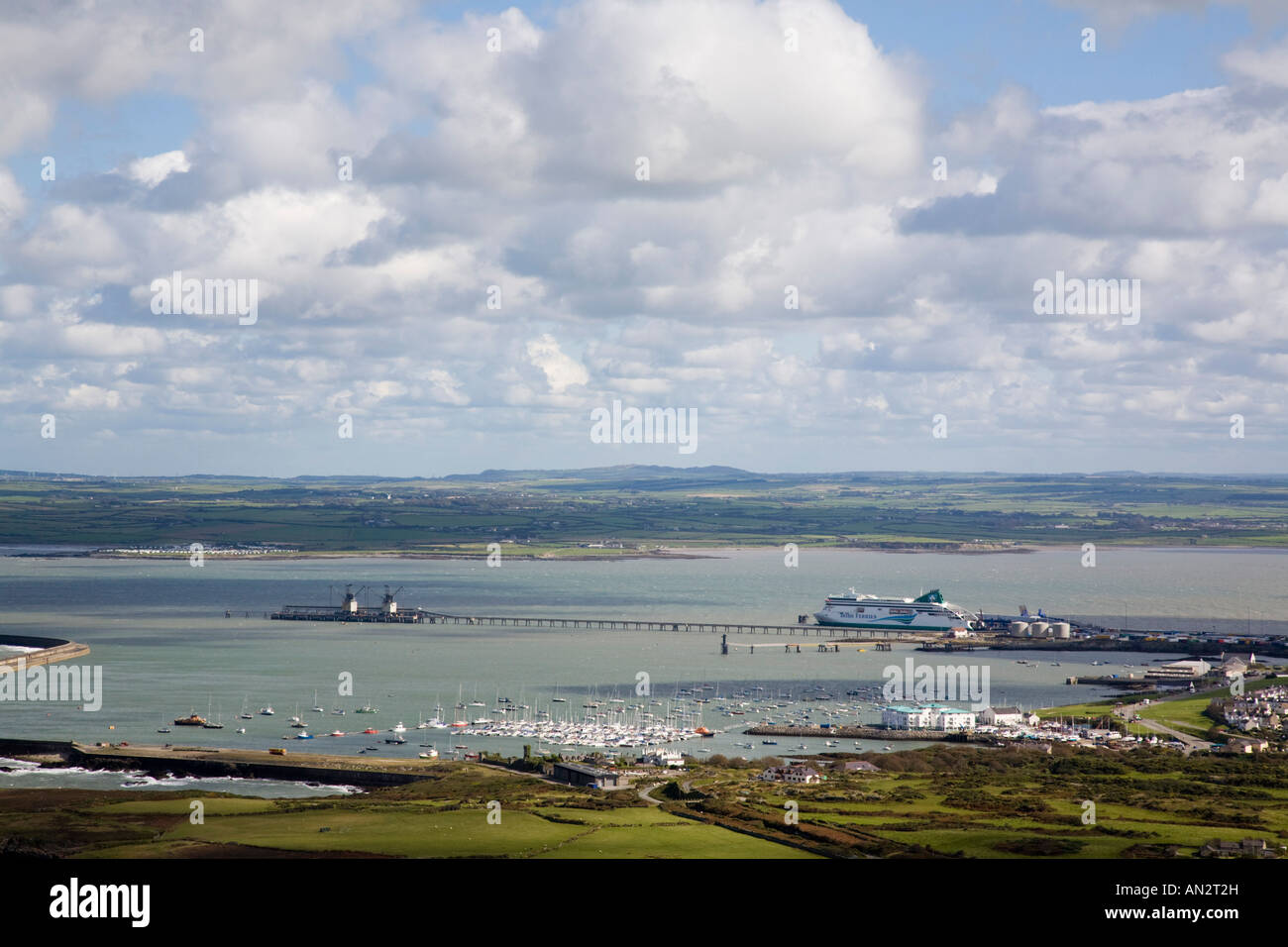 Elevated view of New harbour pier Irish Ferry terminal and coastline from Holyhead Mountain Holy Island Isle of Anglesey North Wales UK Britain Stock Photo
