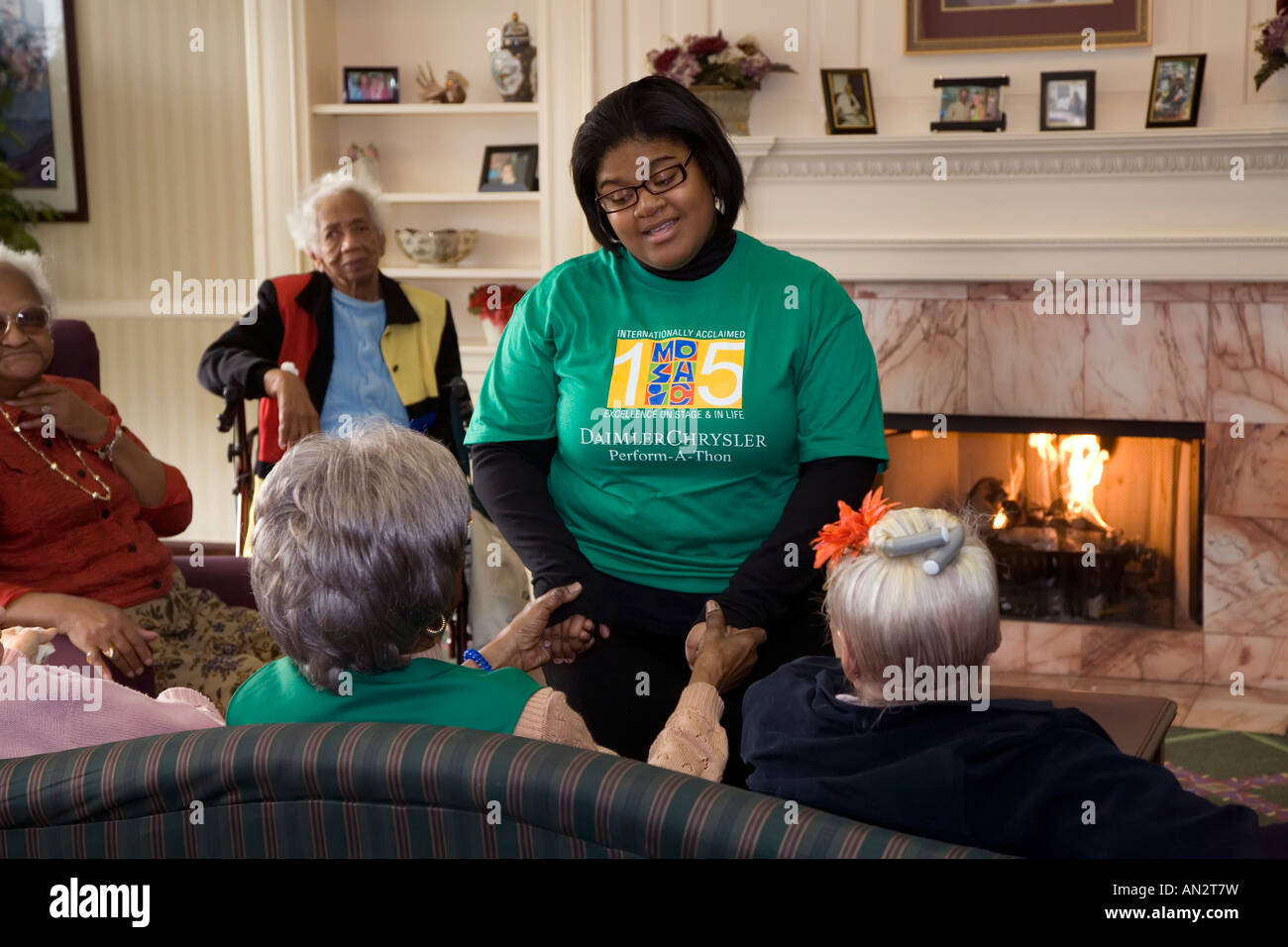 Youth Singing Group Visits Nursing Home Stock Photo