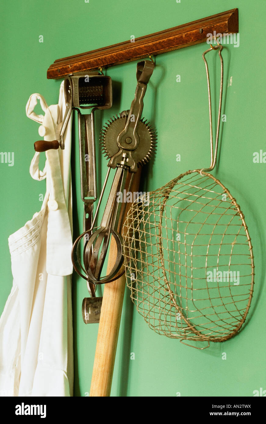 Vintage kitchen gadgets hanging on a wall Stock Photo Alamy