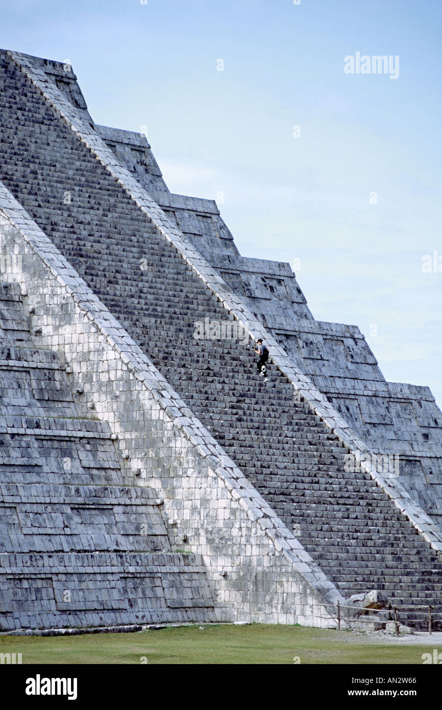 A man climbs the 91 steps of 'El Castillo', the centerpiece of the