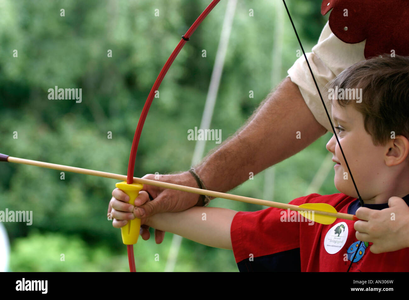 six-year old Lewis tries his hand at archery Stock Photo