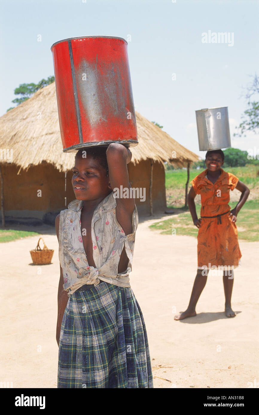 Young girl holding two buckets hires stock photography and images Alamy