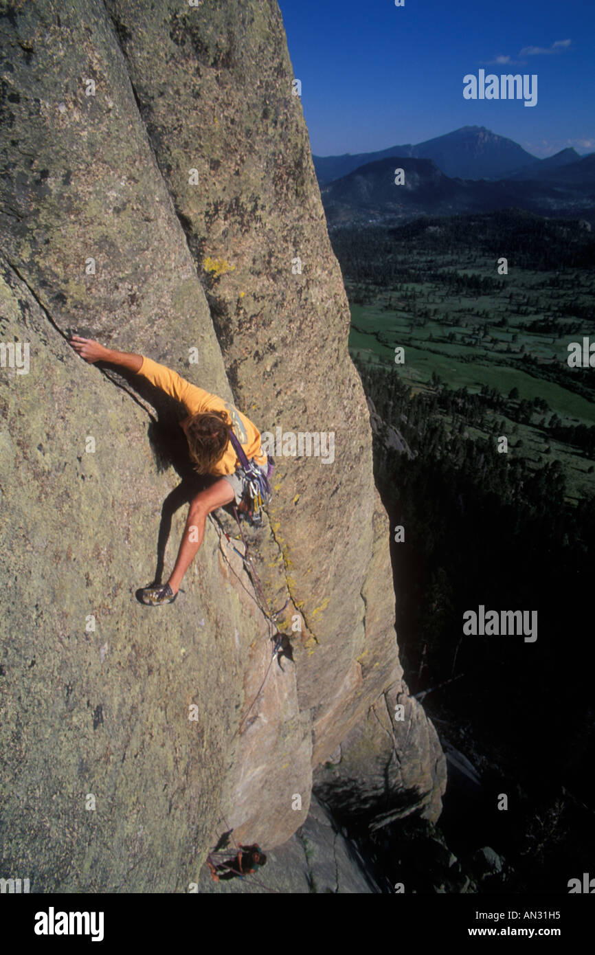 Rock climber reaching for a handhold Stock Photo Alamy