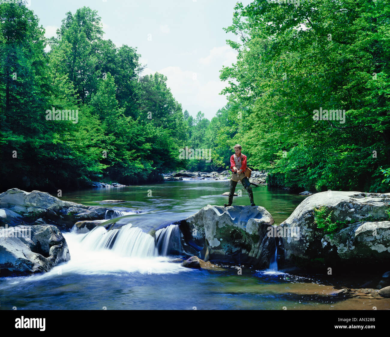man fishing on Little Pigeon River in Tennessee USA Stock Photo
