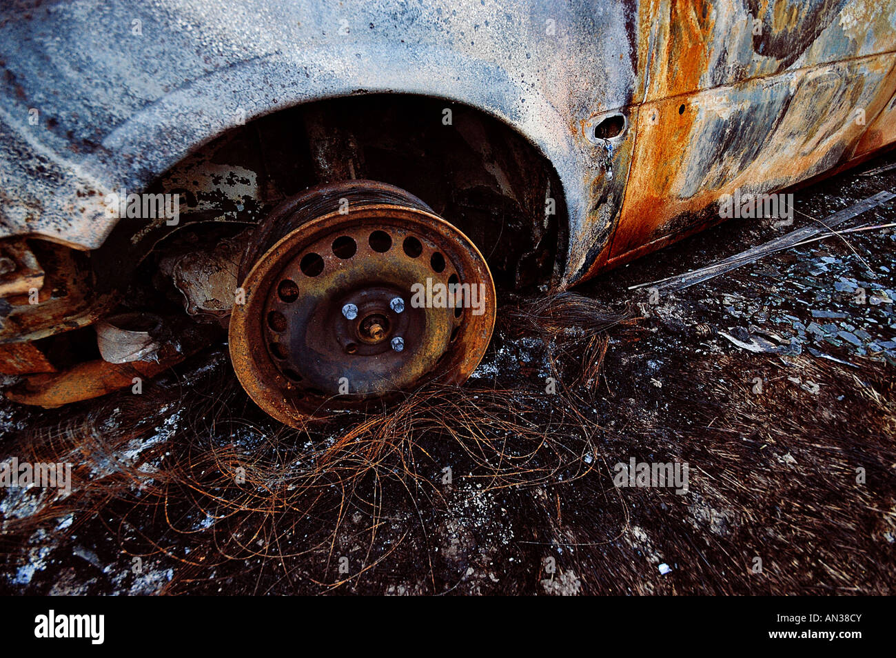 rusty wheel of a burnt out car Stock Photo - Alamy