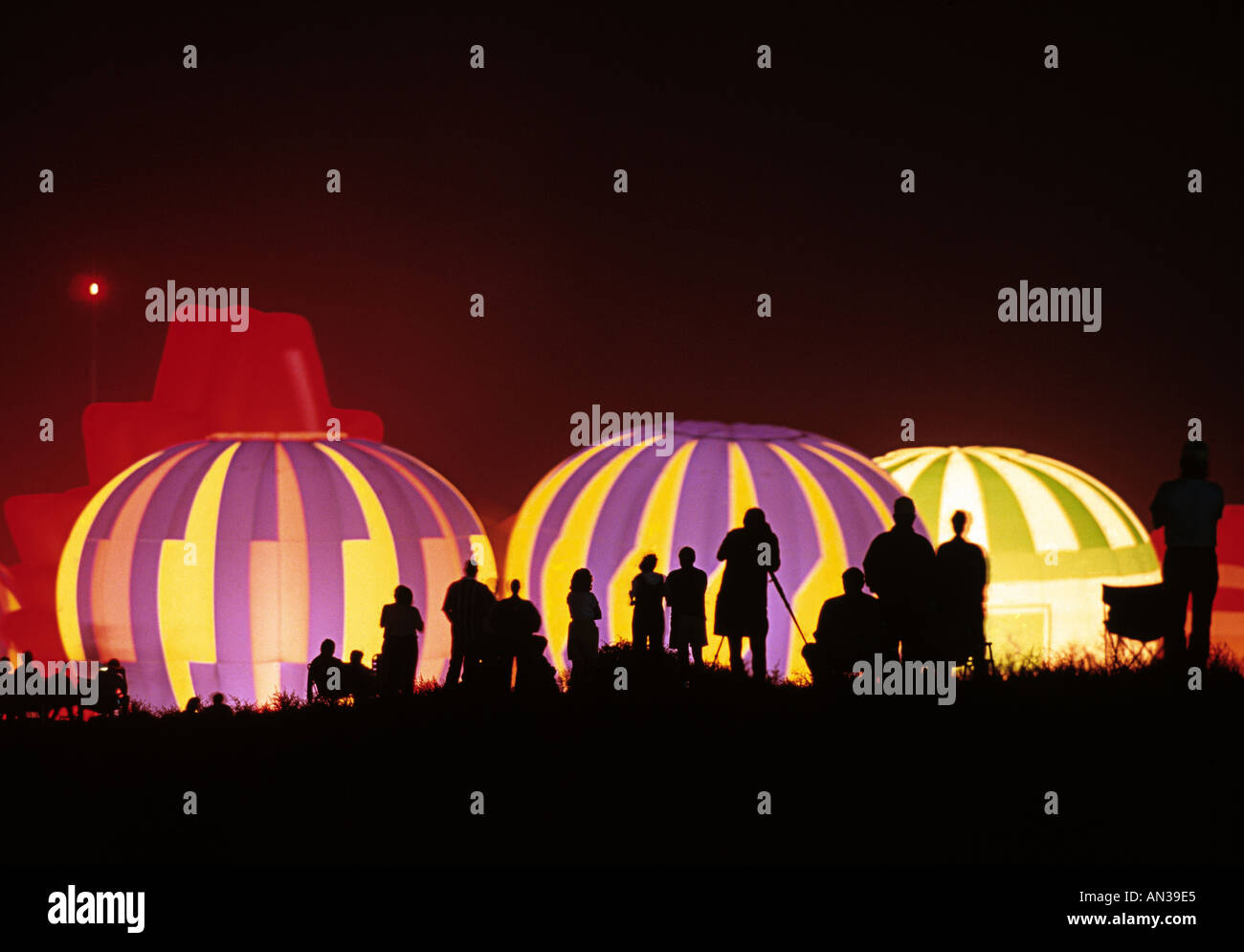 Hot air balloon glowing before sunrise Albuquerque Balloon festival NM USA Stock Photo