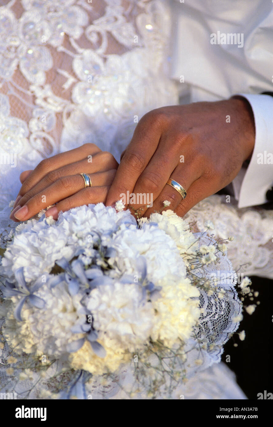 African American Bride And Groom Holding Hands After Wedding